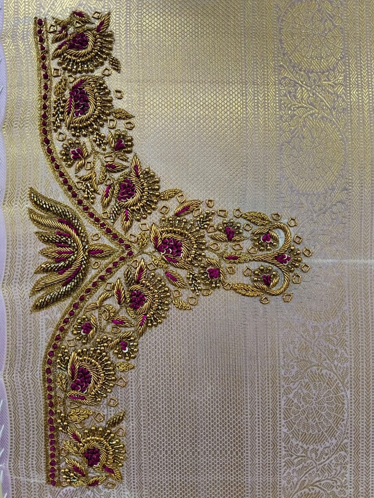 Gold zardosi yoke with maroon beads and lotus motifs on silver silk